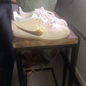 Gold and tan Nike Cortez